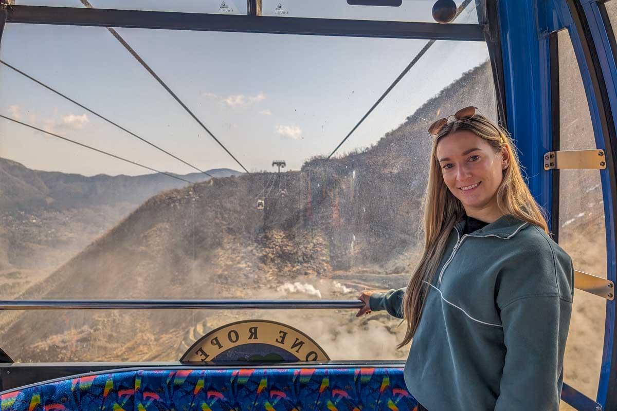 Bailey in a gondola on the ropeway over the owakudani volcanic valley Hakone Japan