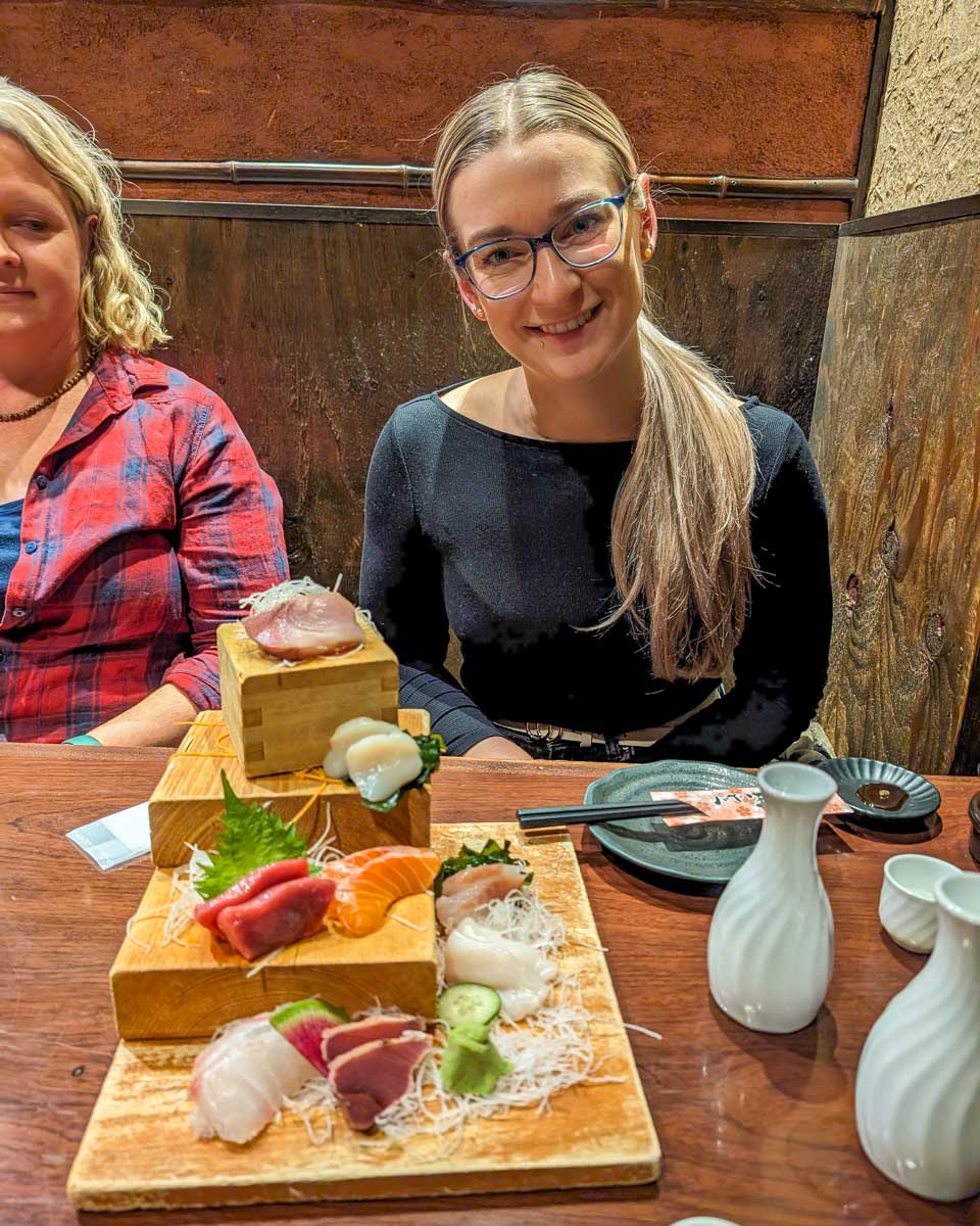 Bailey smiles on a food tour in Tsukiji market in Tokyo Japan