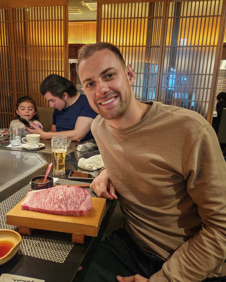 Daniel poses for a photo with a Kobe Beef Steak in Kobe, Japan