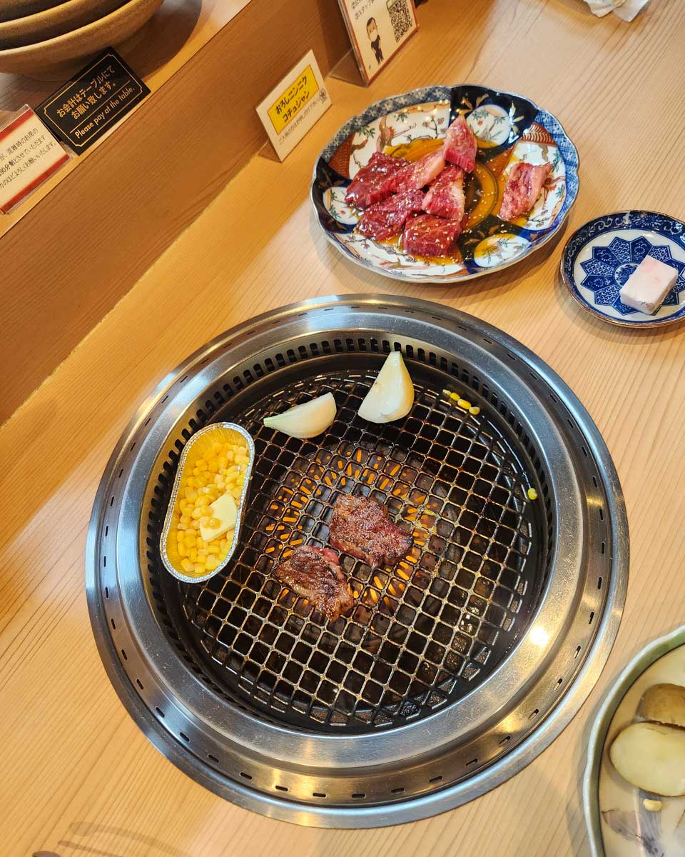 Food being cooked at the table on a food tour in Tokyo Japan