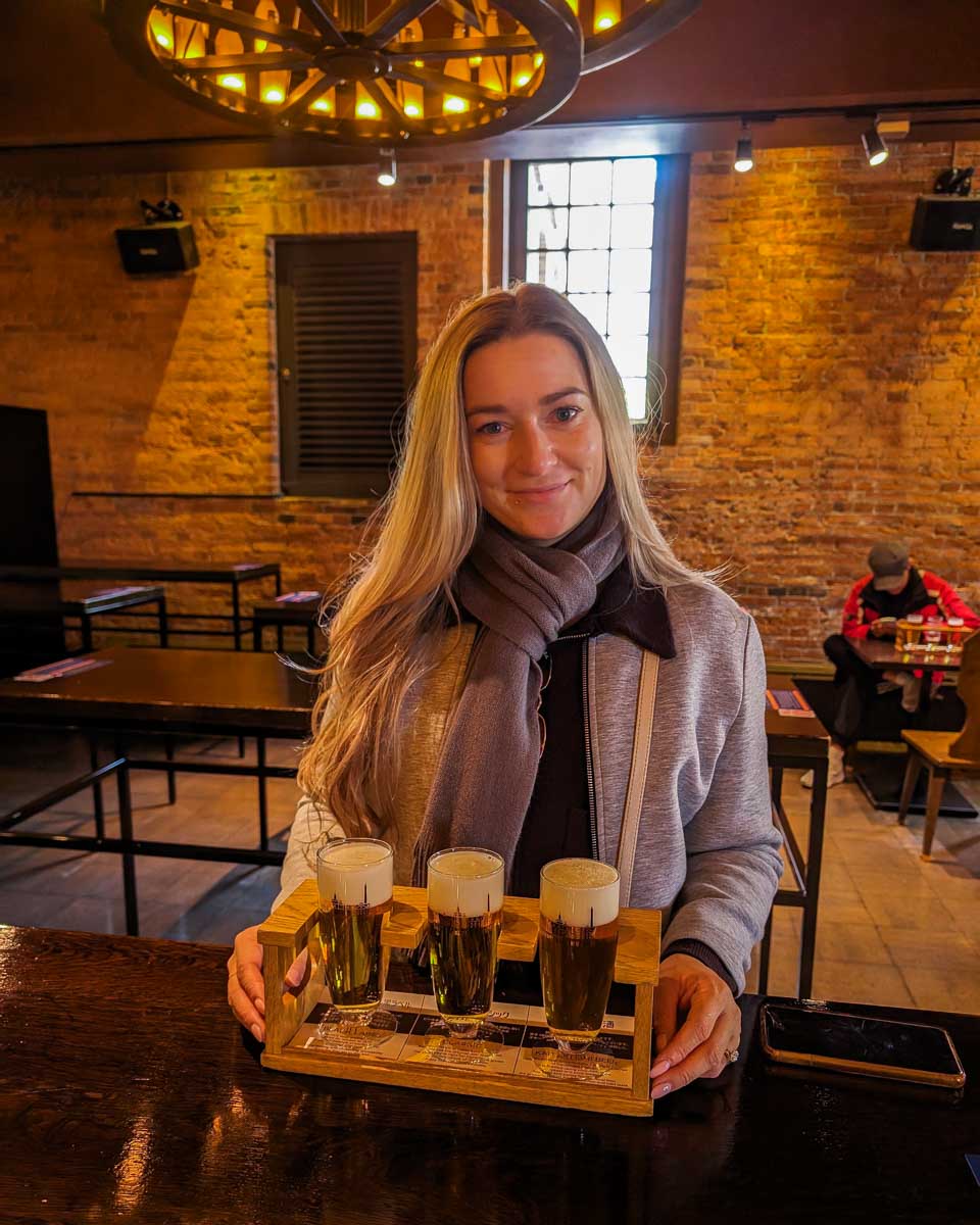 Bailey holds a tasting flight of beer at the Sapporo Beer Museum