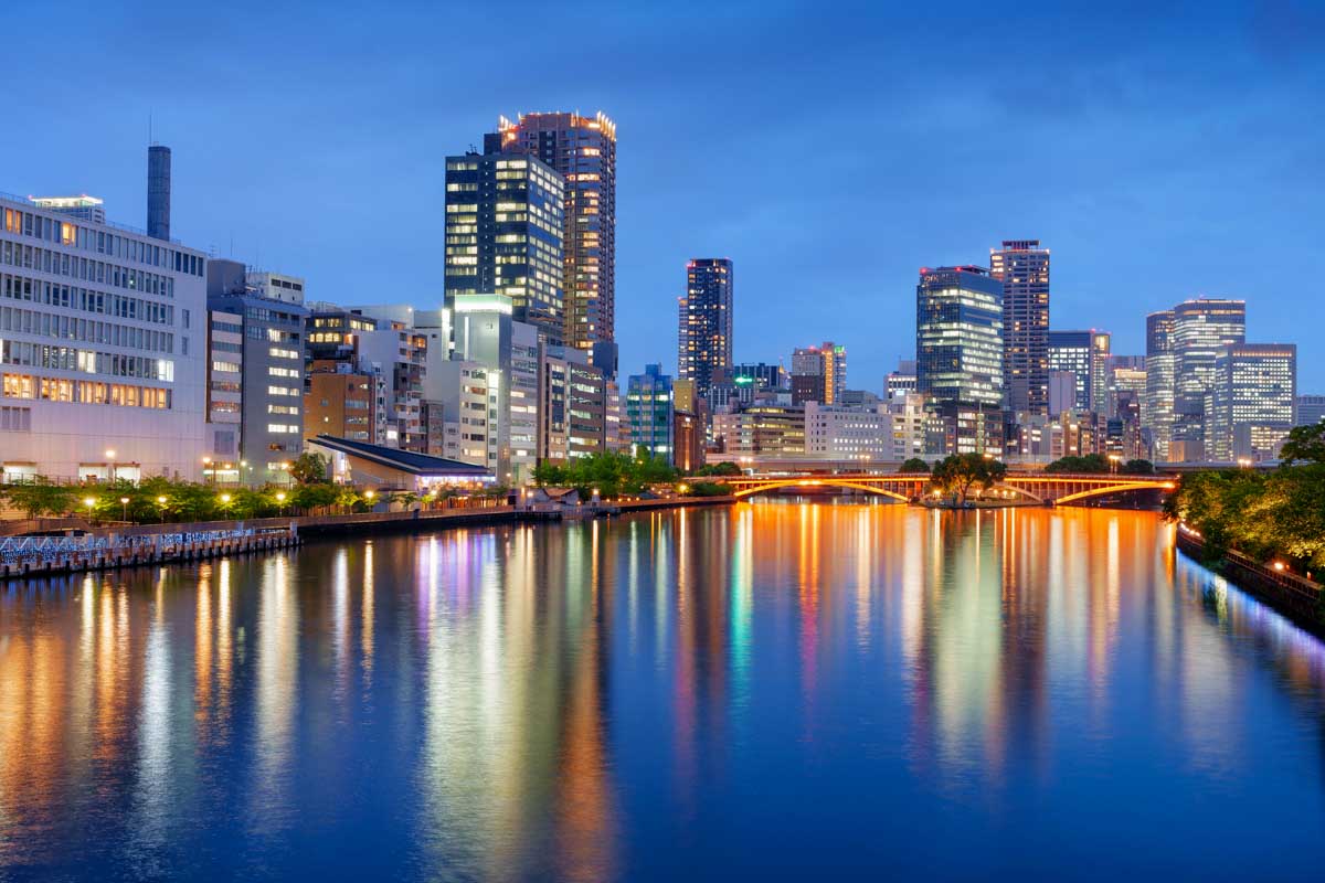 Osaka, Japan cityscape on the river at dusk
