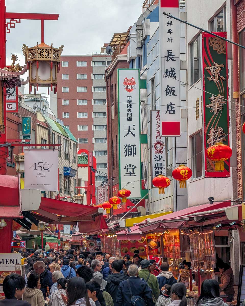 People walk through Chinatown in Kobe Japan