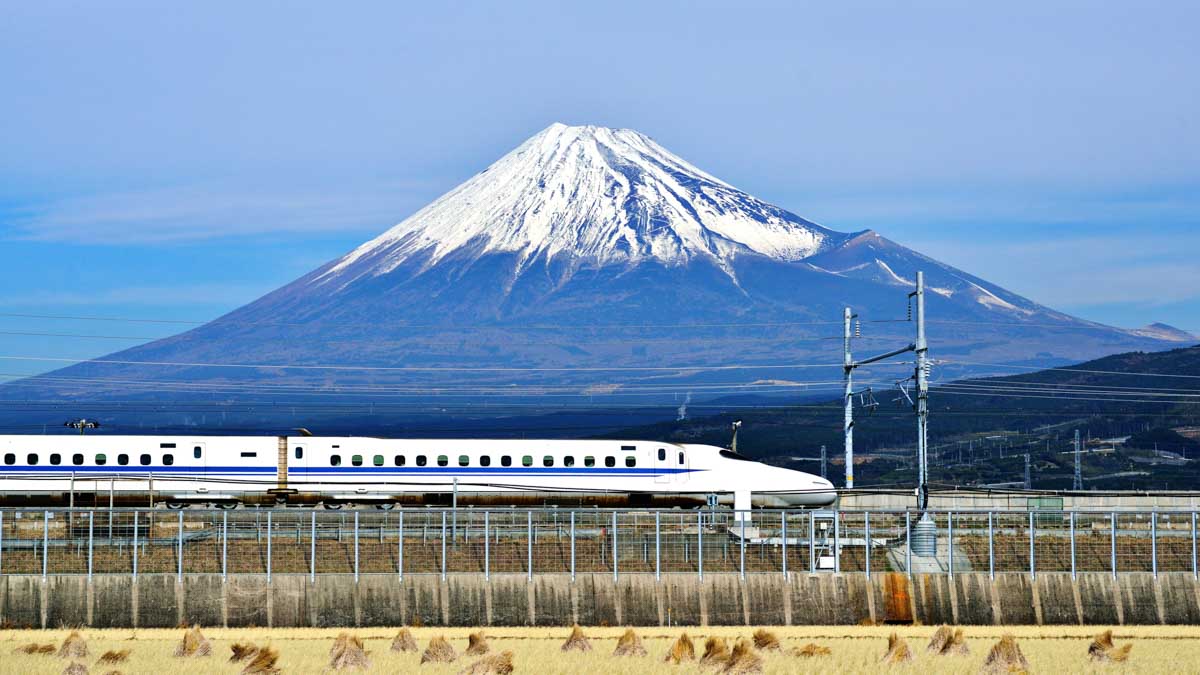 A bullet train passess Mt Fuji in Japan