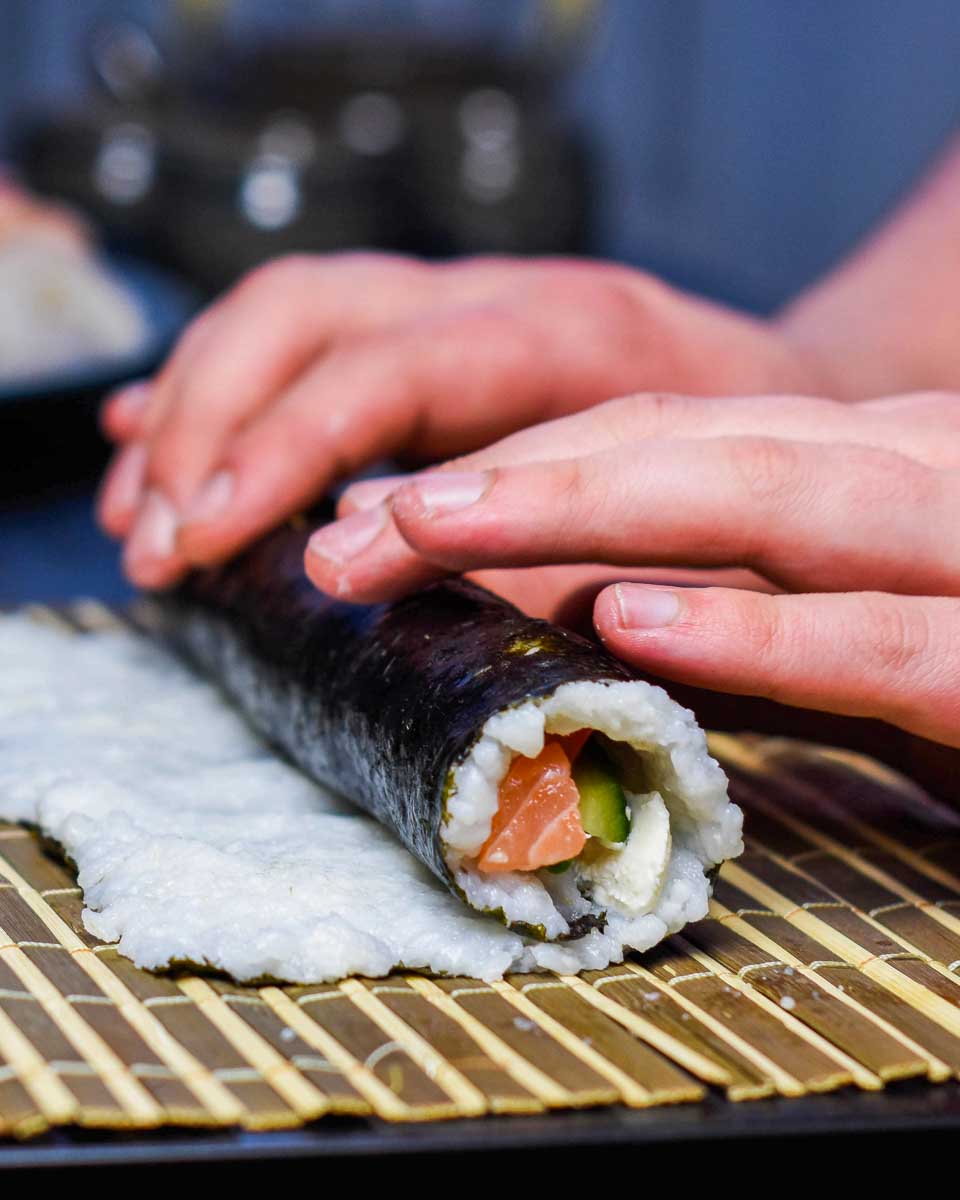 A-person-rolls-sushi-during-a-cooking-class-in-Nara-Japan
