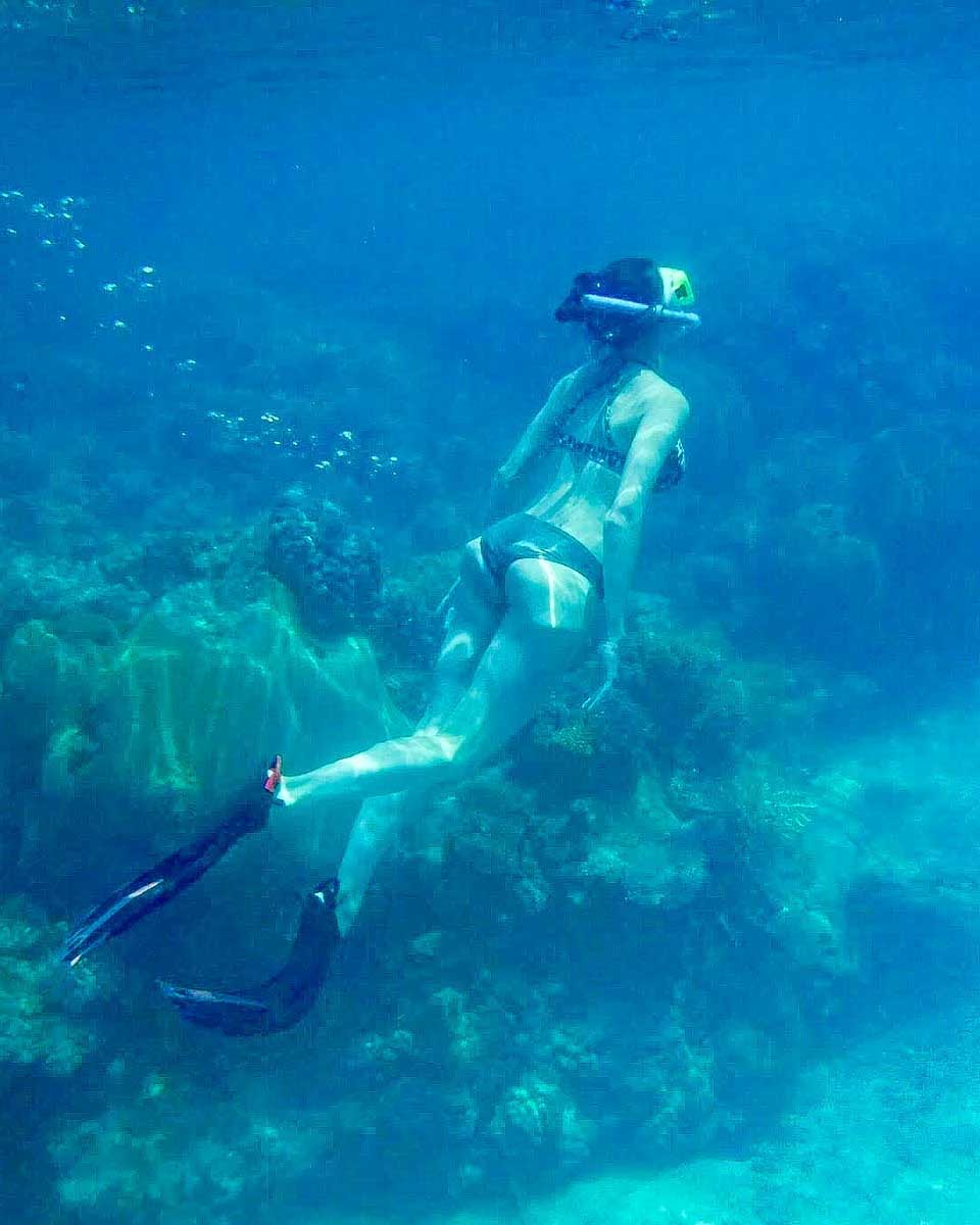 A-woman-snorkels-during-a-tour from Okinawa Japan