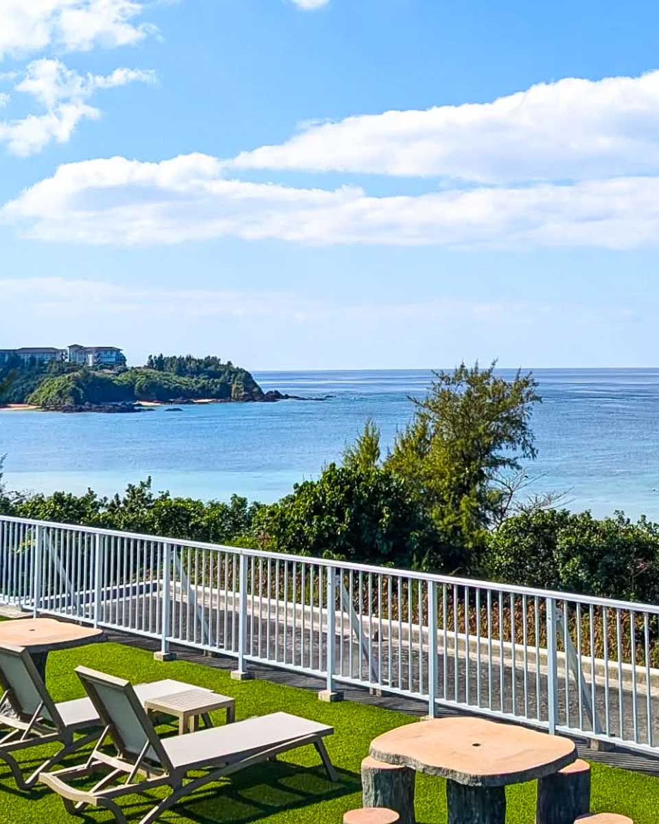 Outdoor patio with ocean view at Odysis Onna Resort Hotel in Okinawa