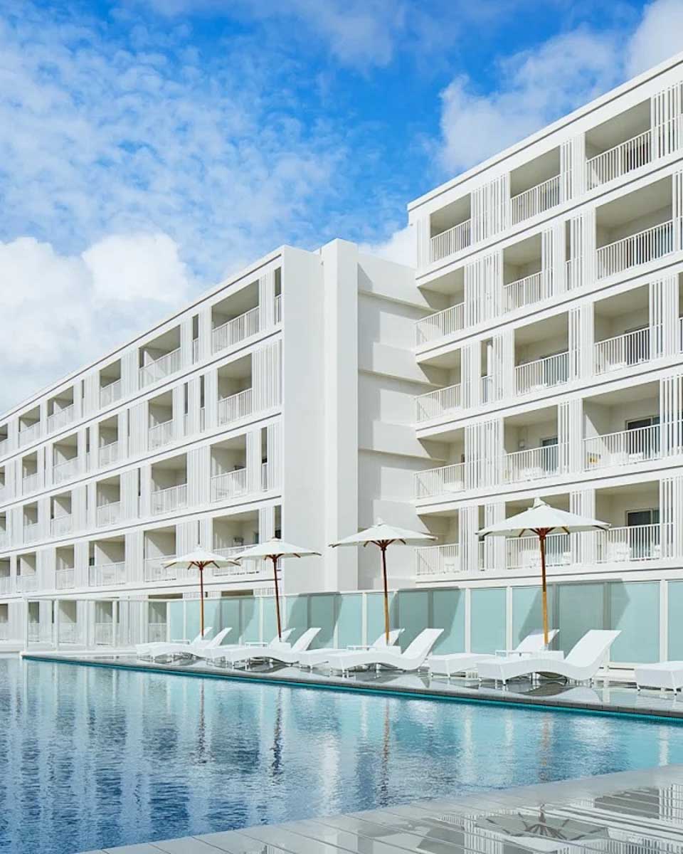 Outdoor pool area at BEB5 Okinawa Seragaki by Hoshino Resorts