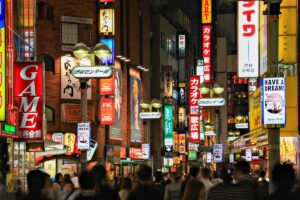 A busy street in Shibuya at night in Tokyo Japan