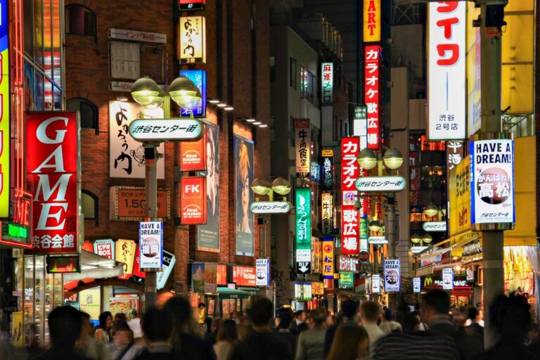 A busy street in Shibuya at night in Tokyo Japan