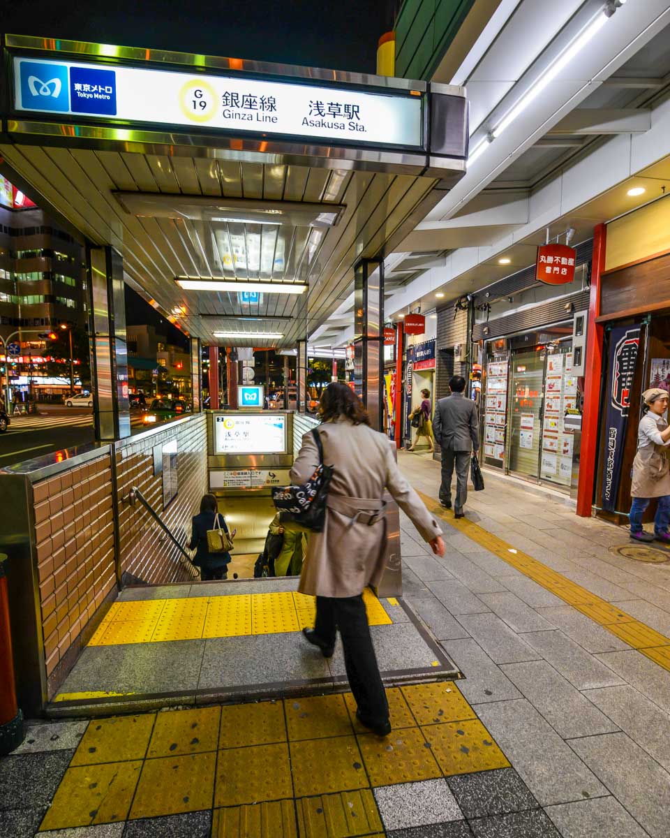A person walking into the metro station in Japan