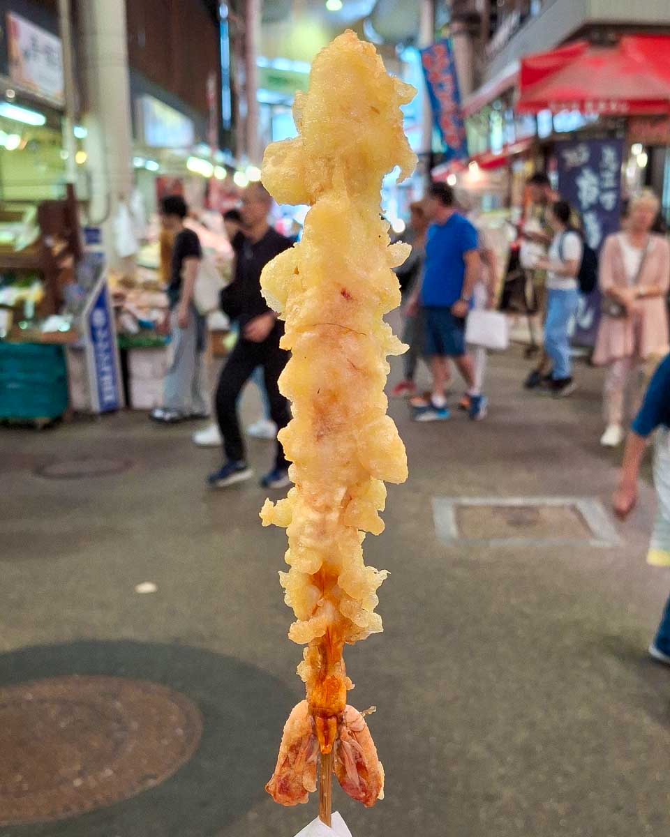 A-stick-of-shrimp-tempura-in-Omicho Market Kanazawa Japan