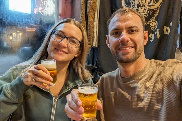Bailey-and-Daniel-take-a-selfie-while-holding-two-drinks-in-Nagano Japan