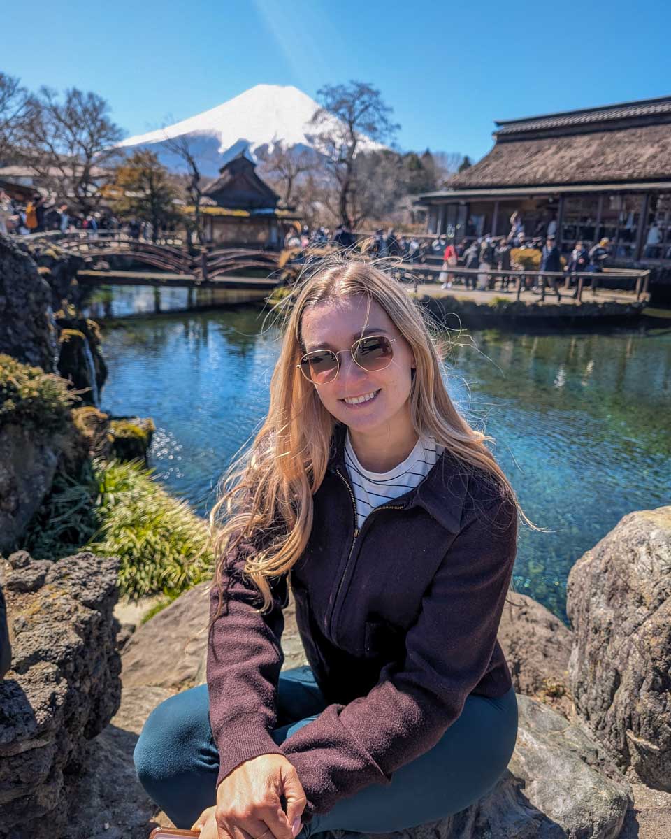 Bailey-sits-at-one-of-the-ponds-of-Oshino-Hakkai-Japan-with-Mt-Fuji-in-the-background-on-a-tour-from Asakusa-Tokyo