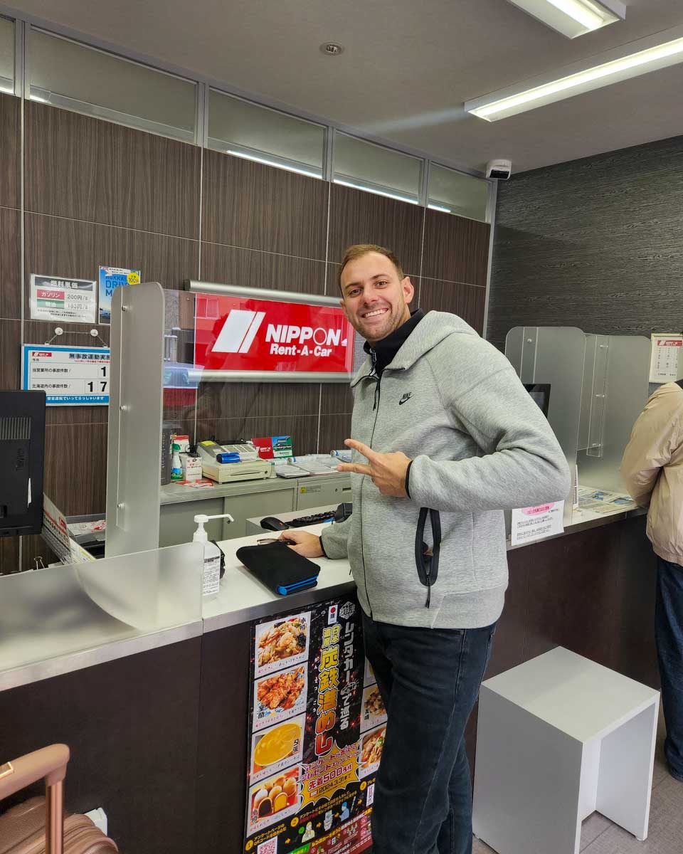 Daniel renting a car in Japan