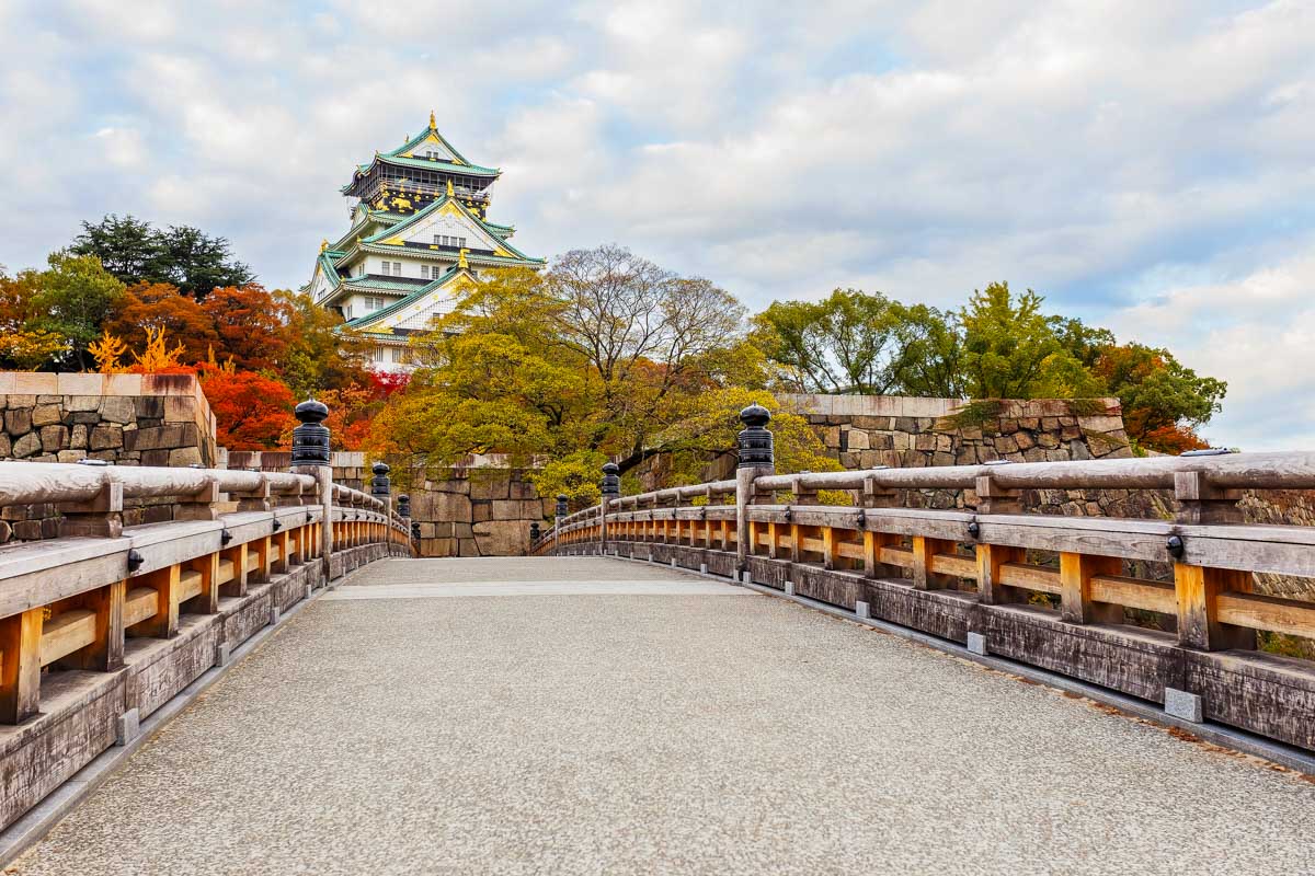 Osaka Castle with autumn leaves in Japan