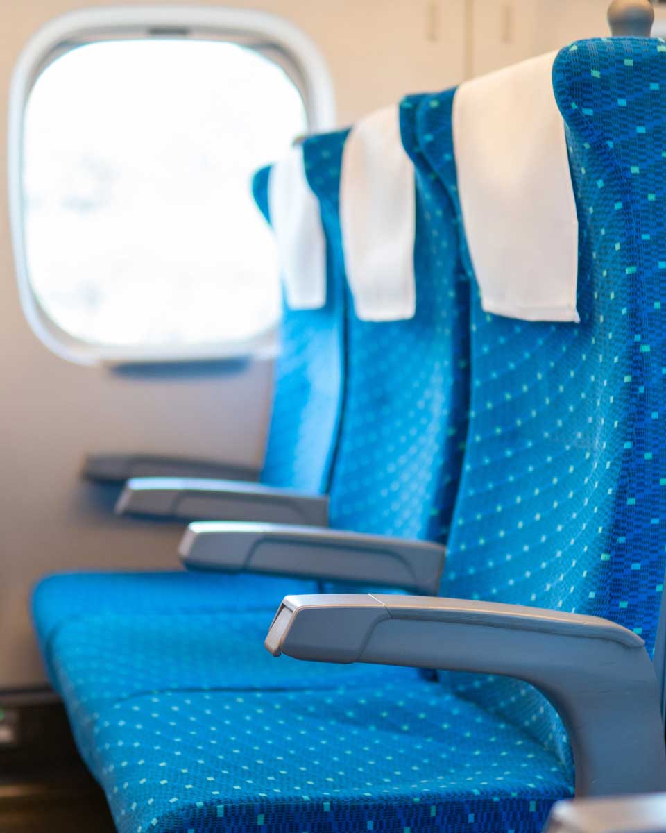Row of empty seats on commuter train in Japan