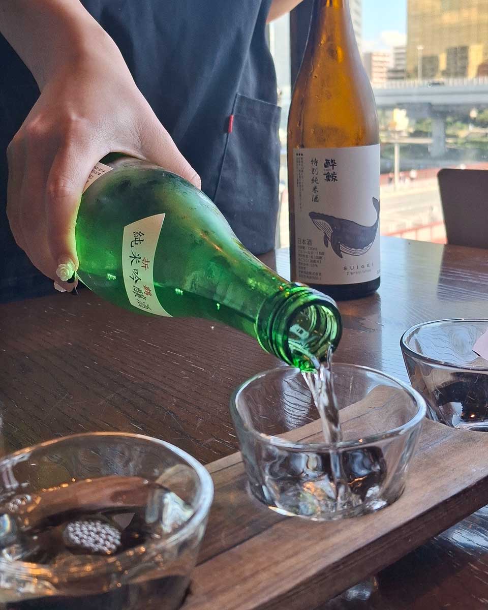 Sake-being-poured-in-Tokyo-Japan