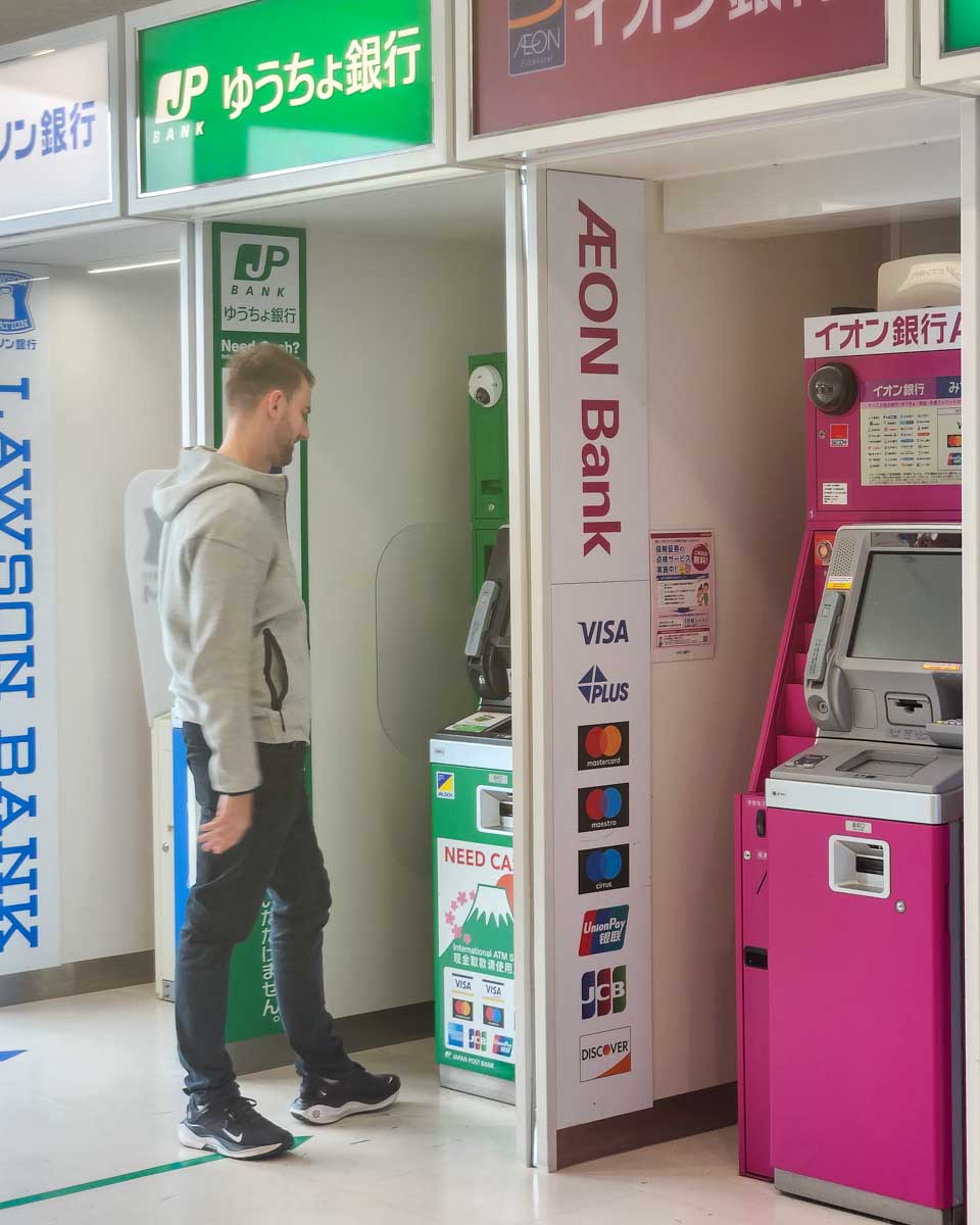 Daniel at an ATM in Japan