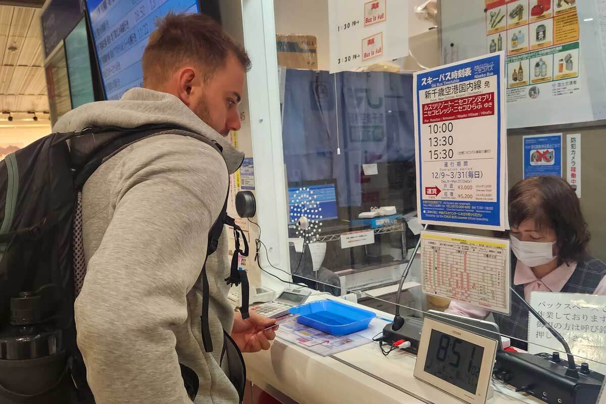 Daniel speaks to a woman in Japan