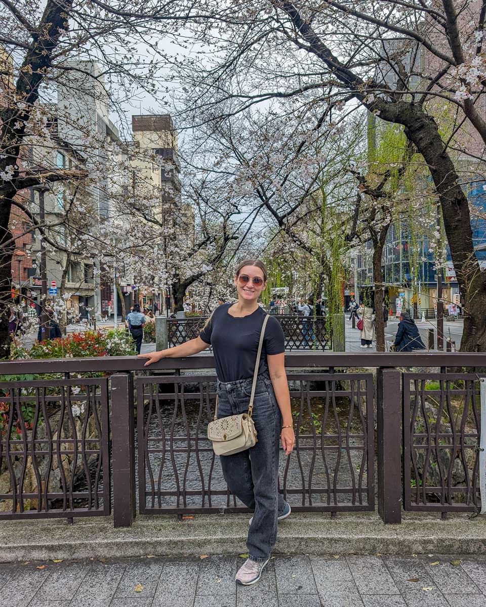 Bailey poses at the Takase River in Kyoto, Japan