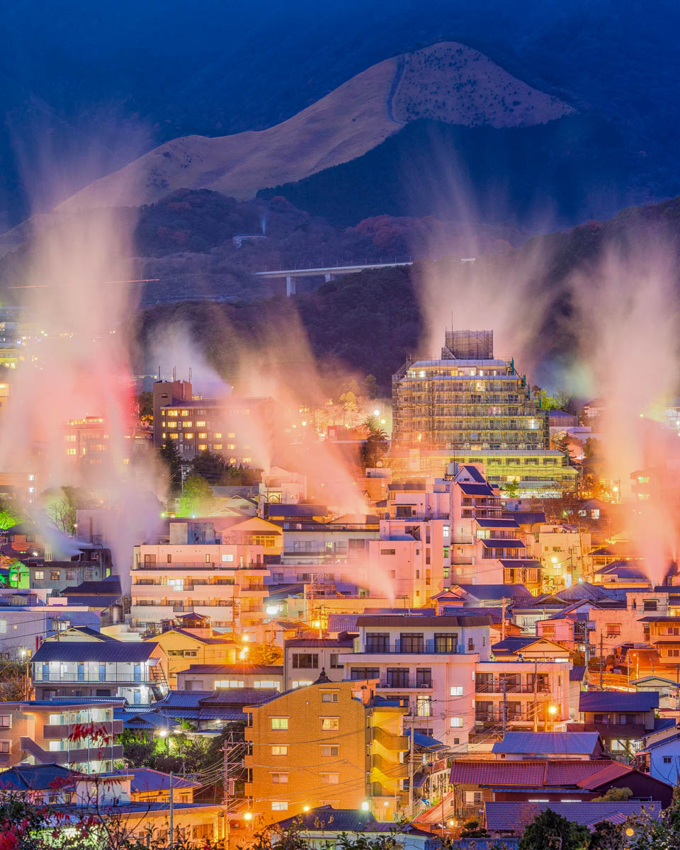 Steam rising from hot springs at night in Beppu Japan (2)