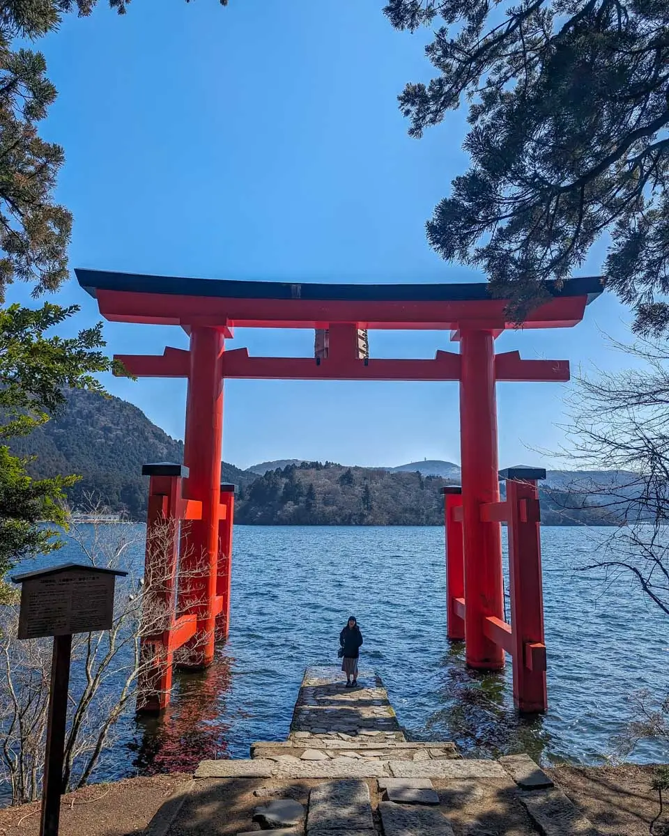 A woman at-Heiwa-no-Torii-at-Hakone-Shrine-on-Lake-Ashi-Hakone-Japan