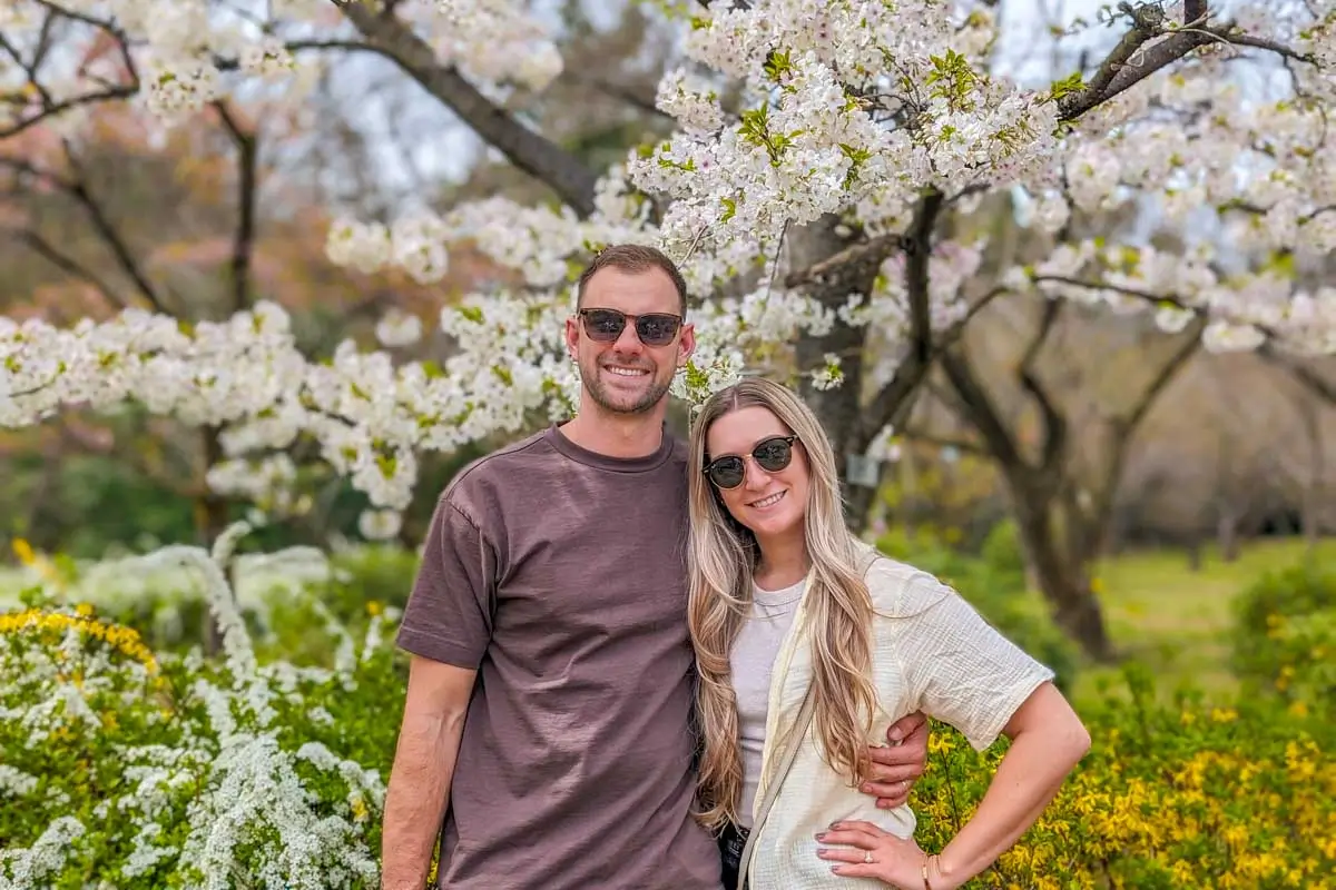 Daniel and Bailey with cherry blossoms in Japan